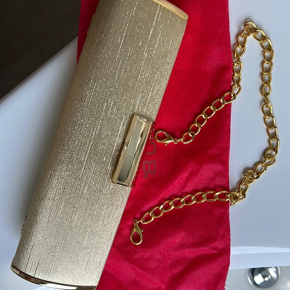 Arden B Gold, good condition slim clutch with removable strap chain